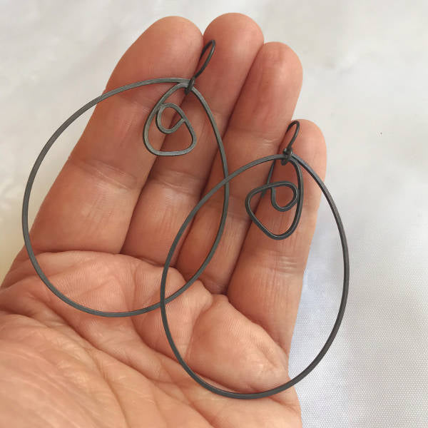 Labyrinth Earrings XL, oxidized sterling silver dangle earrings, shown on hand for scale