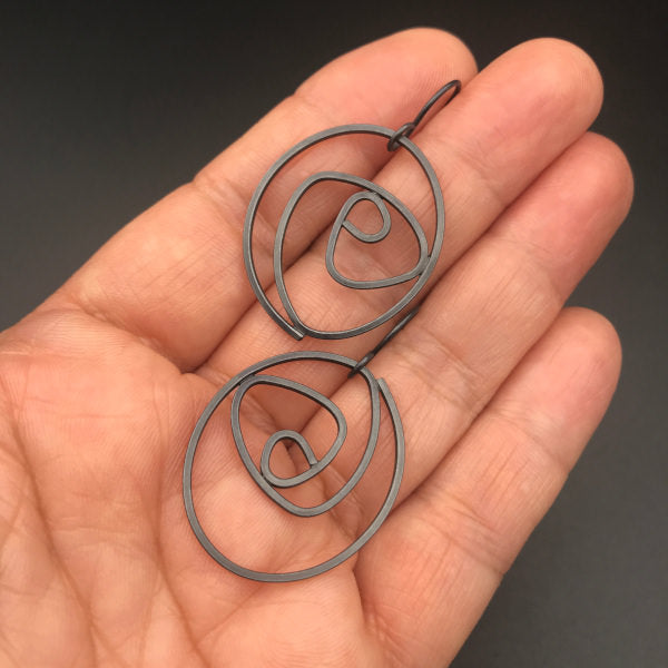 Labyrinth Earrings Large, oxidized sterling silver dangle earrings, shown on hand for scale