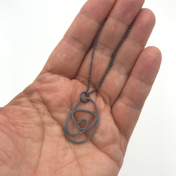 Labyrinth Necklace, oxidized sterling silver on 16" or 18" oxidized sterling silver chain shown on hand for scale