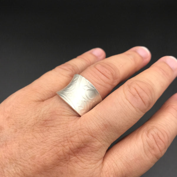 Eden Adjustable Ring sterling silver flora pattern worn on  hand to show scale