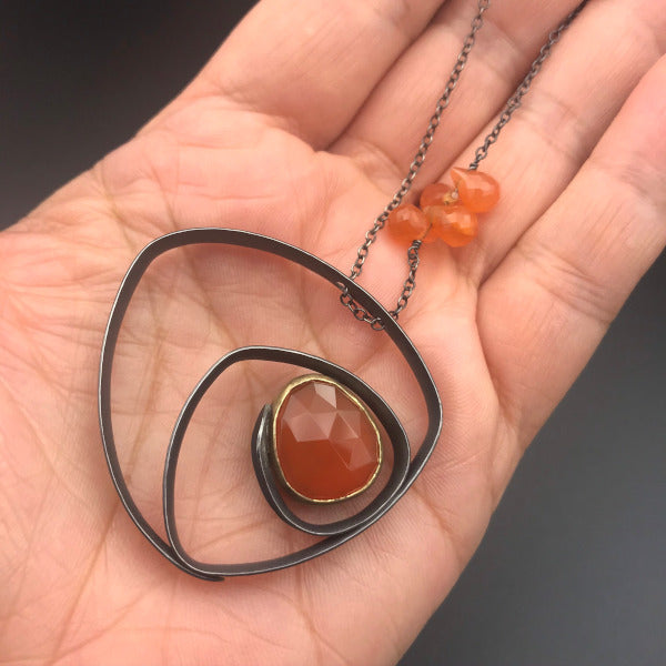 Glasgow Necklace with orange carnelian in 18k yellow gold bezel oxidized sterling silver
