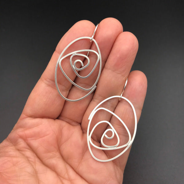 Labyrinth Earrings oval shaped spiral dangles sterling lightweight comfortable shown on hand for scale