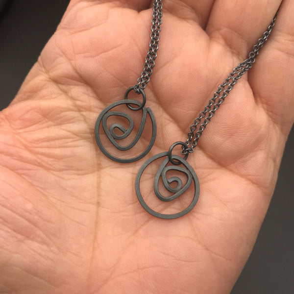 Labyrinth Necklace Small sterling silver on 16" or 18" sterling silver chain, shown on hand for scale