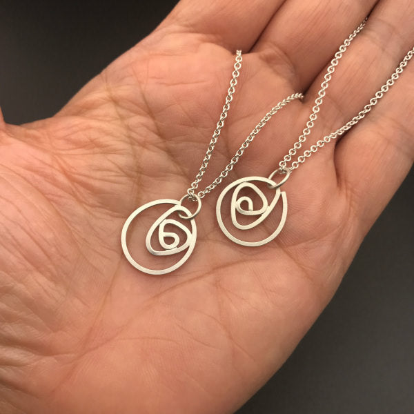 Labyrinth Necklace Small sterling silver on 16" or 18" sterling silver chain, shown on hand for scale