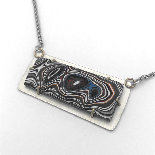 Fordite Pendant Silver and Gold Necklace No 4 by tkmetalarts, sterling silver setting with 18k gold prongs, comes on an 20 to 22 inch chain, multicolor pattern.